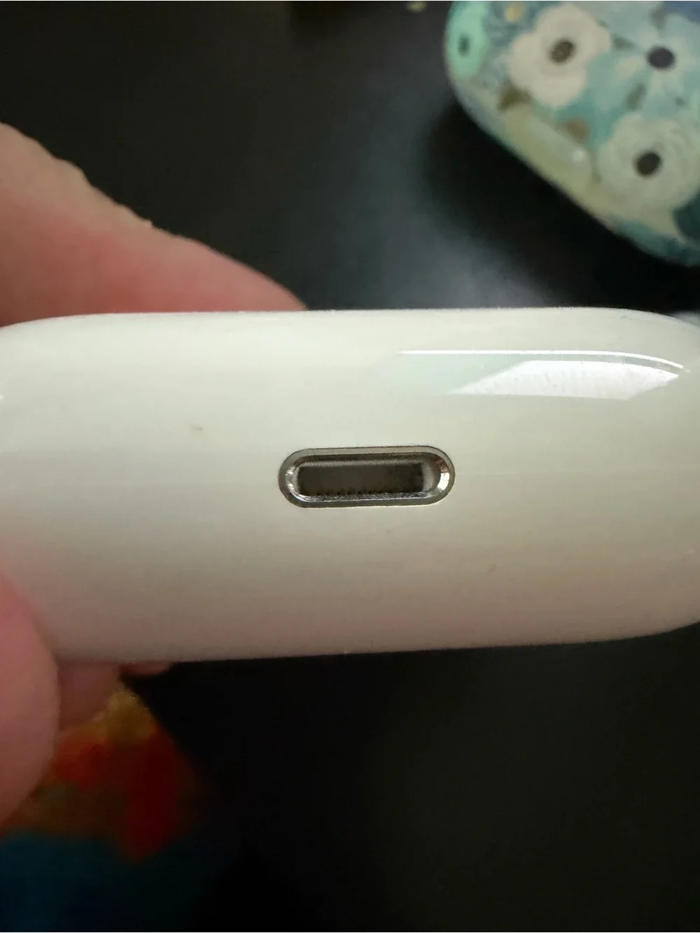 1st generation Apple AirPods Pro with rifle paper company case